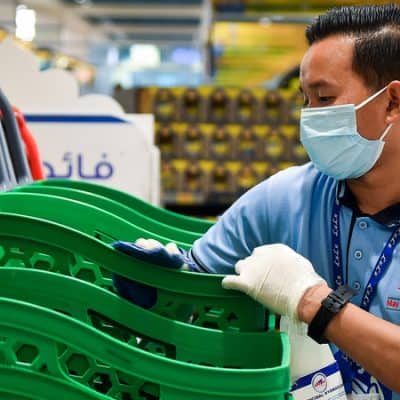 In Dubai an employee sterilises shopping Carts at The Hypermarket Prevent Coronavirus Disease